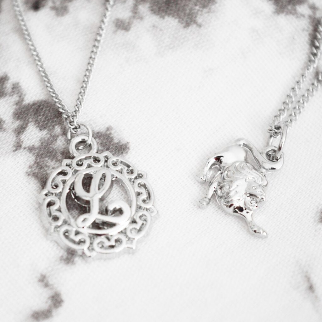 Shop Dixi Zodiac & Initial Necklaces Silver boho necklaces, one lion for leo and one L initial necklace.