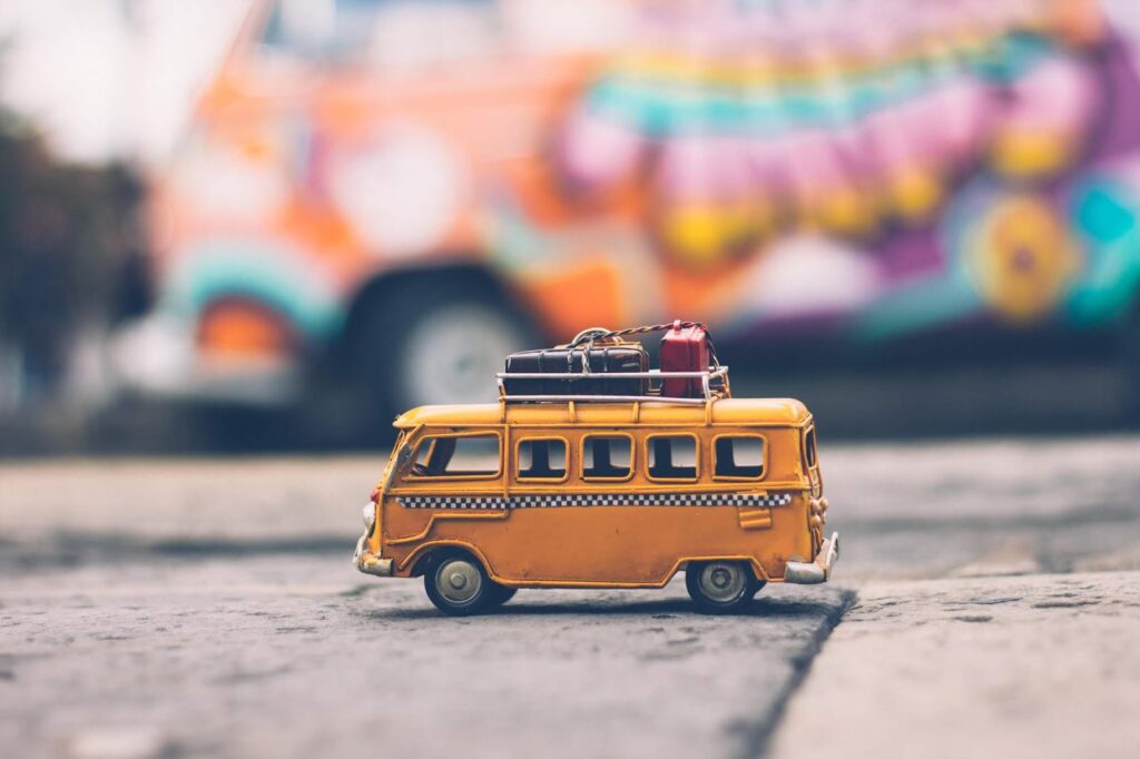 Campervan A yellow campervan with a blurry coloured background.