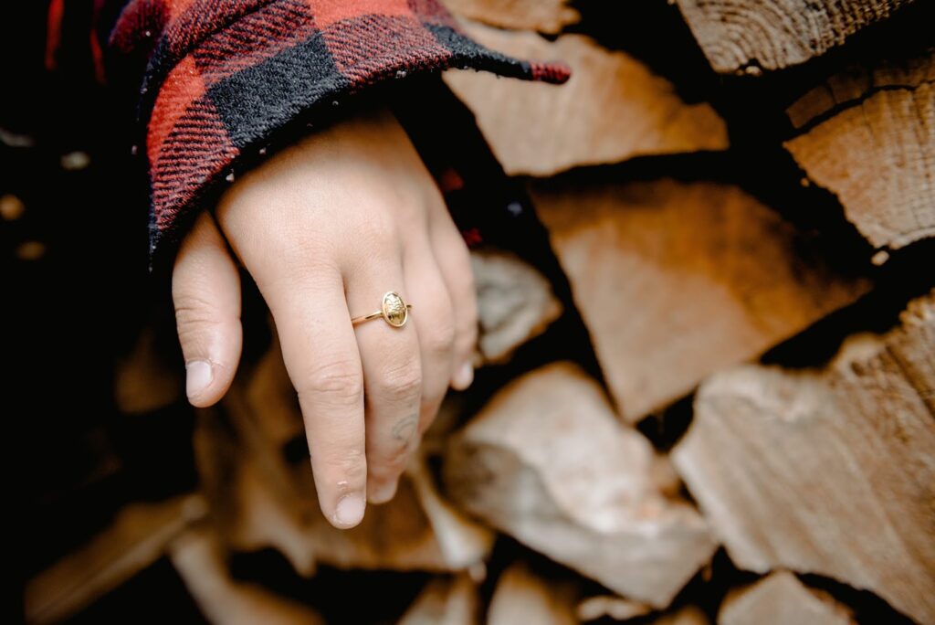 Gold Statement Ring Close up of a hand wearing a gold statement ring.